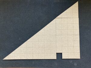 A 4-by-3 right triangle sits on top of a 4-by-7 rectangle, which sits beside a 9-by-7 right triangle, giving the appearance of a large 13-by-10 right triangle with a 1-square-inch hole. The rectangle is itself subdivided into 3 pieces, and contains a missing square.